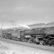 Two big boys hitched together to pull an especially heavy load of 90 cars in 1958.